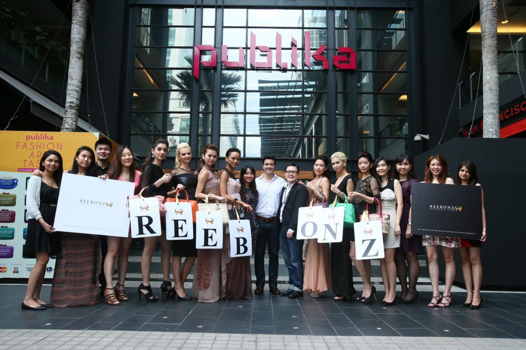 Models posing with Reebonz Malaysia team