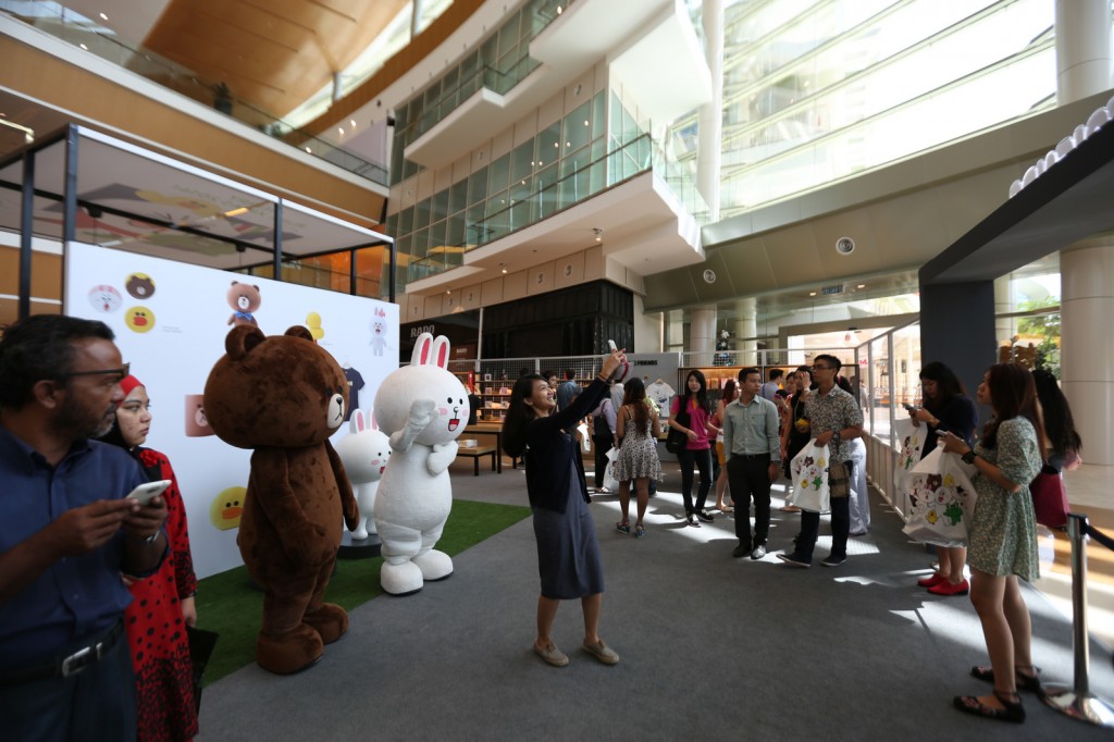 LINE Pop-up Stores taking a picture with LINE characters, Brown (Left) and Cony (Right)