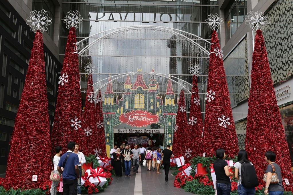 Shoppers are greeted by oversized Christmas trees and wrapped gift decorations at Pavilion KL's Bukit Bintang Entrance