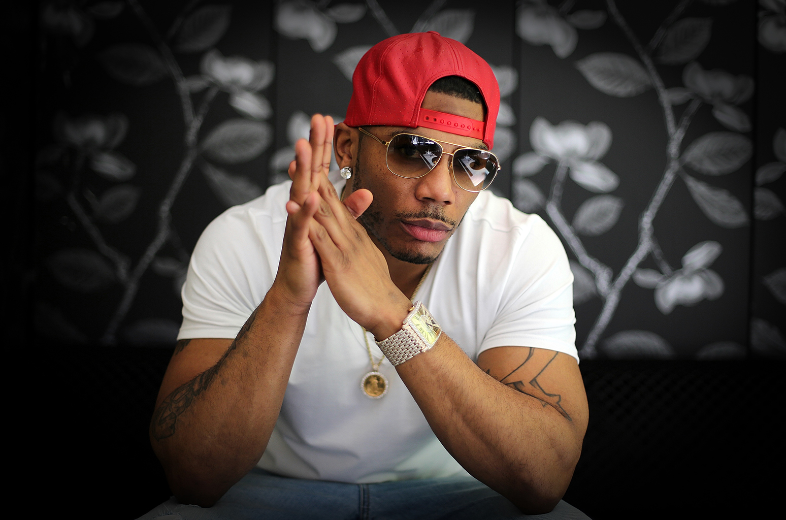 SYDNEY, AUSTRALIA - DECEMBER 19: (EUROPE AND AUSTRALASIA OUT) American rapper Nelly poses during a photo shoot in Sydney, New South Wales to promote his Australian tour. (Photo by Adam Taylor/Newspix/Getty Images)