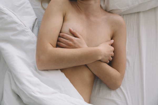 topless woman in the bed